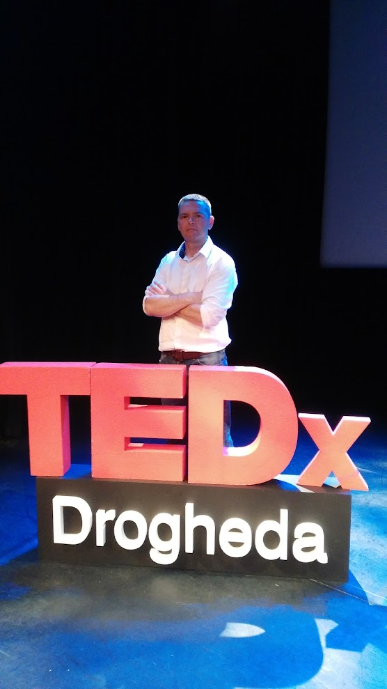 Barry James speaking on stage at TEDx Drogheda